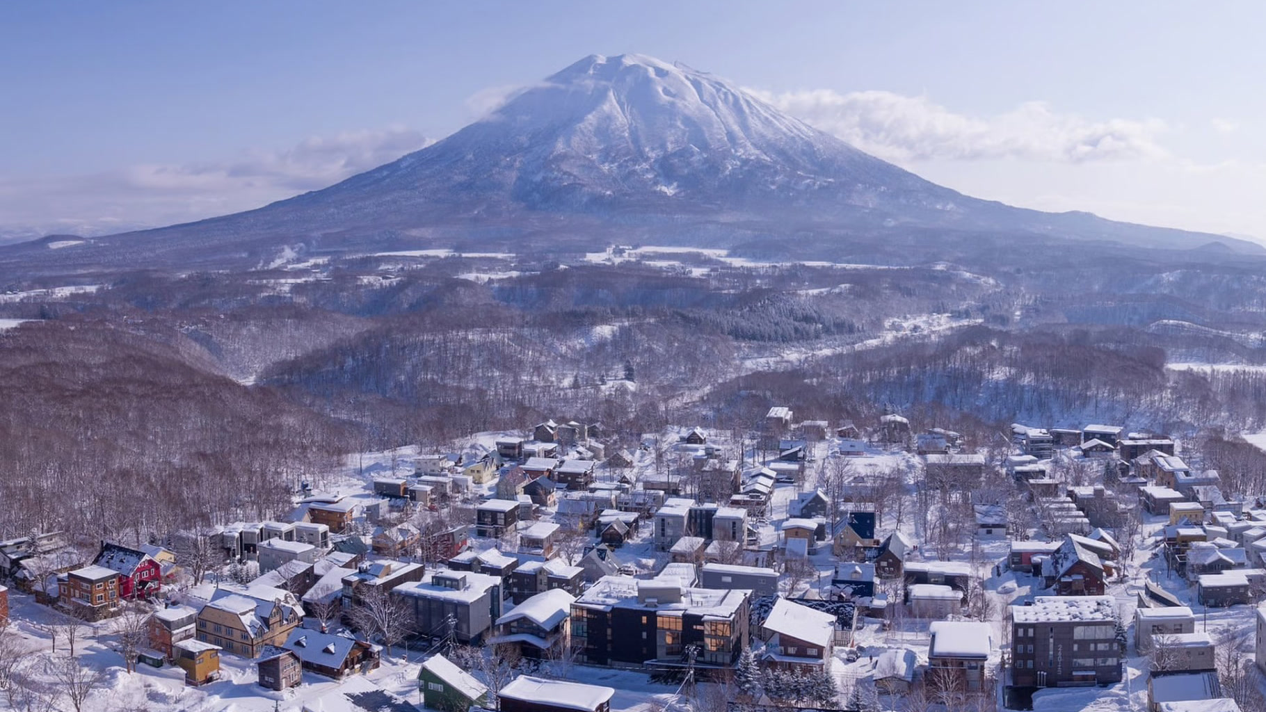 Mt. Yotei Rising Above Snow-Covered Hirafu Village at Dawn