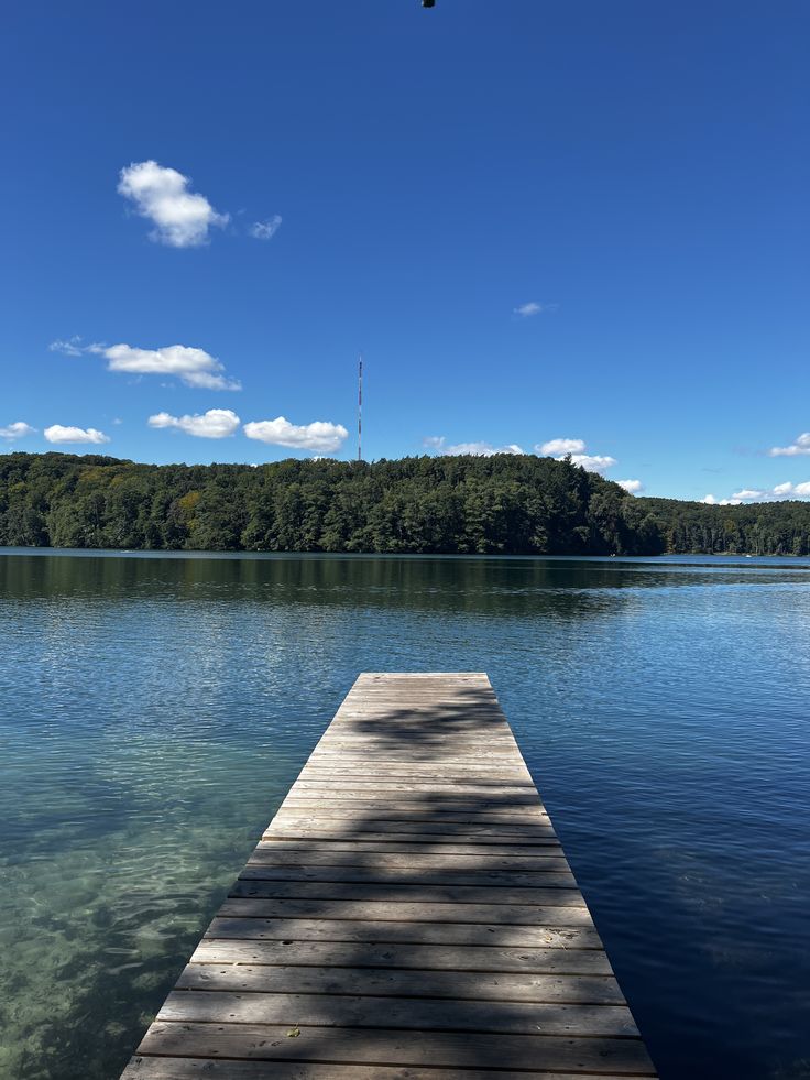 Private Wooden Dock Reaching into the Clear Blue Water of Lake Joseph