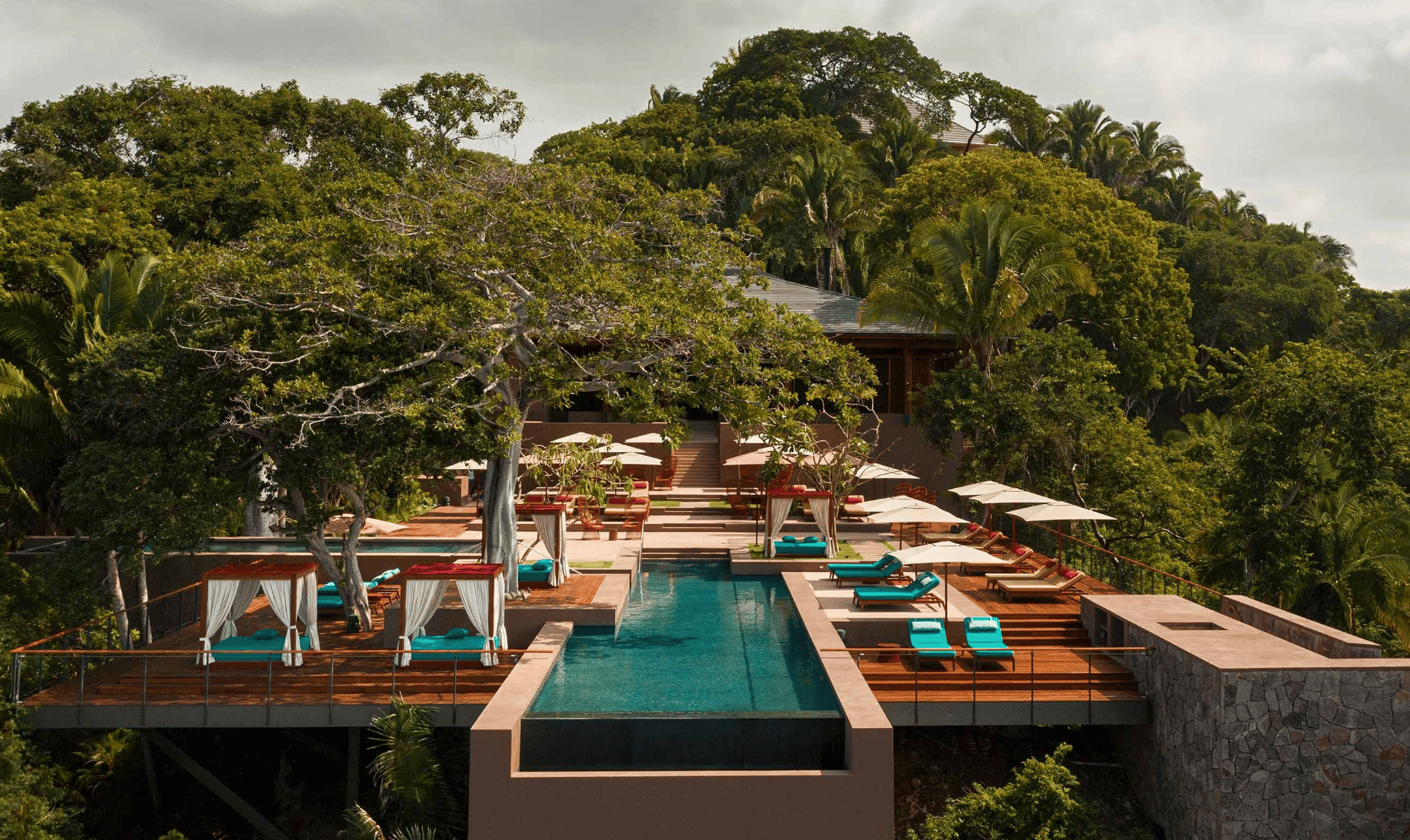Multi-Tiered Resort Pool with Cabanas in the Rainforest