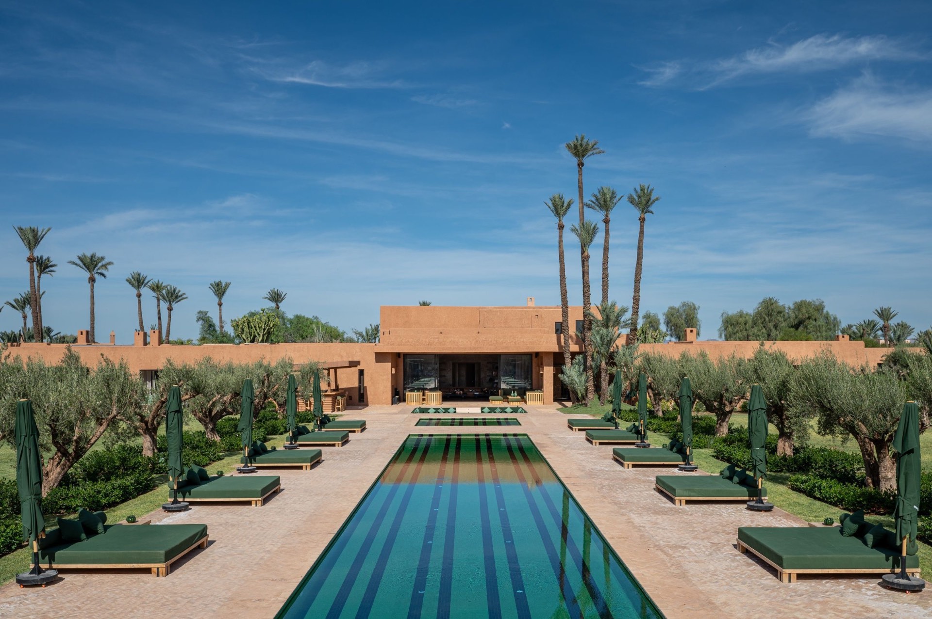 Grand Reflecting Pool with Olive Grove and Estate Facade