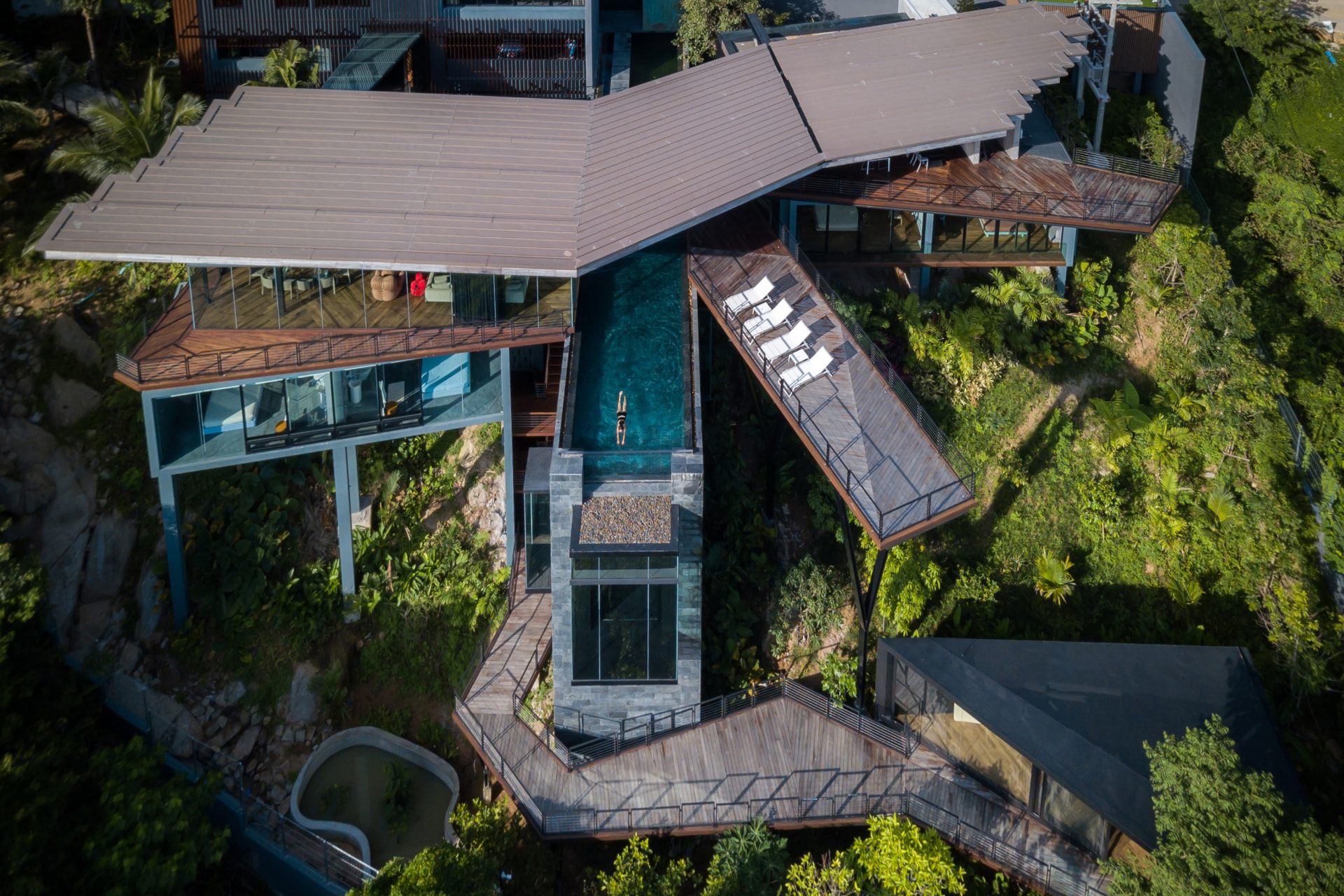 Aerial View of the Hillside Glass House and Cantilevered Teak Decks