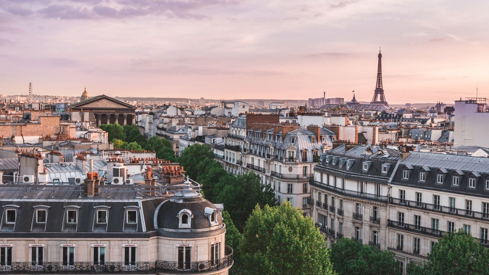 Paris Rooftops at Sunset with Eiffel Tower on the Horizon