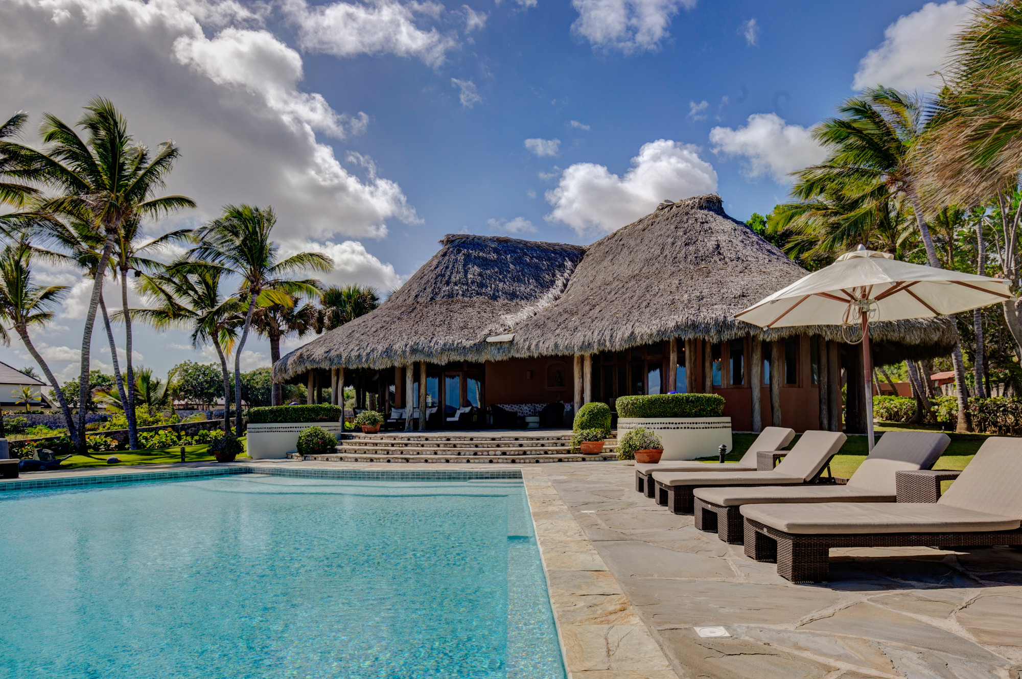Infinity Pool and Thatched Oceanfront Gazebo with Loungers