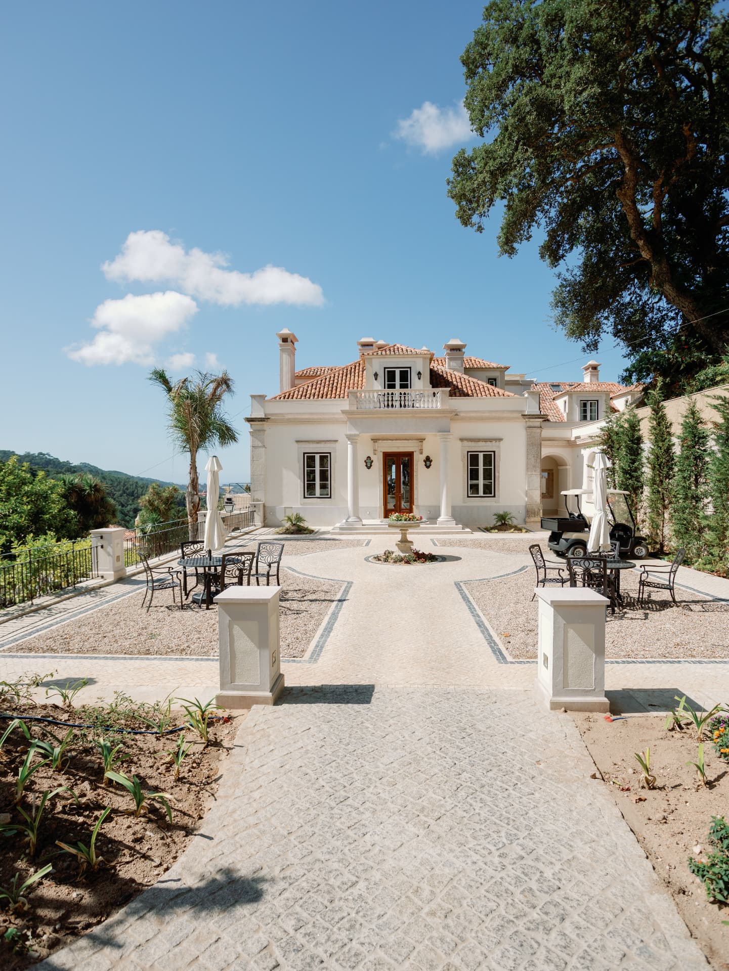 Grand Manor Facade with Cobbled Courtyard, Fountain and Golf Cart