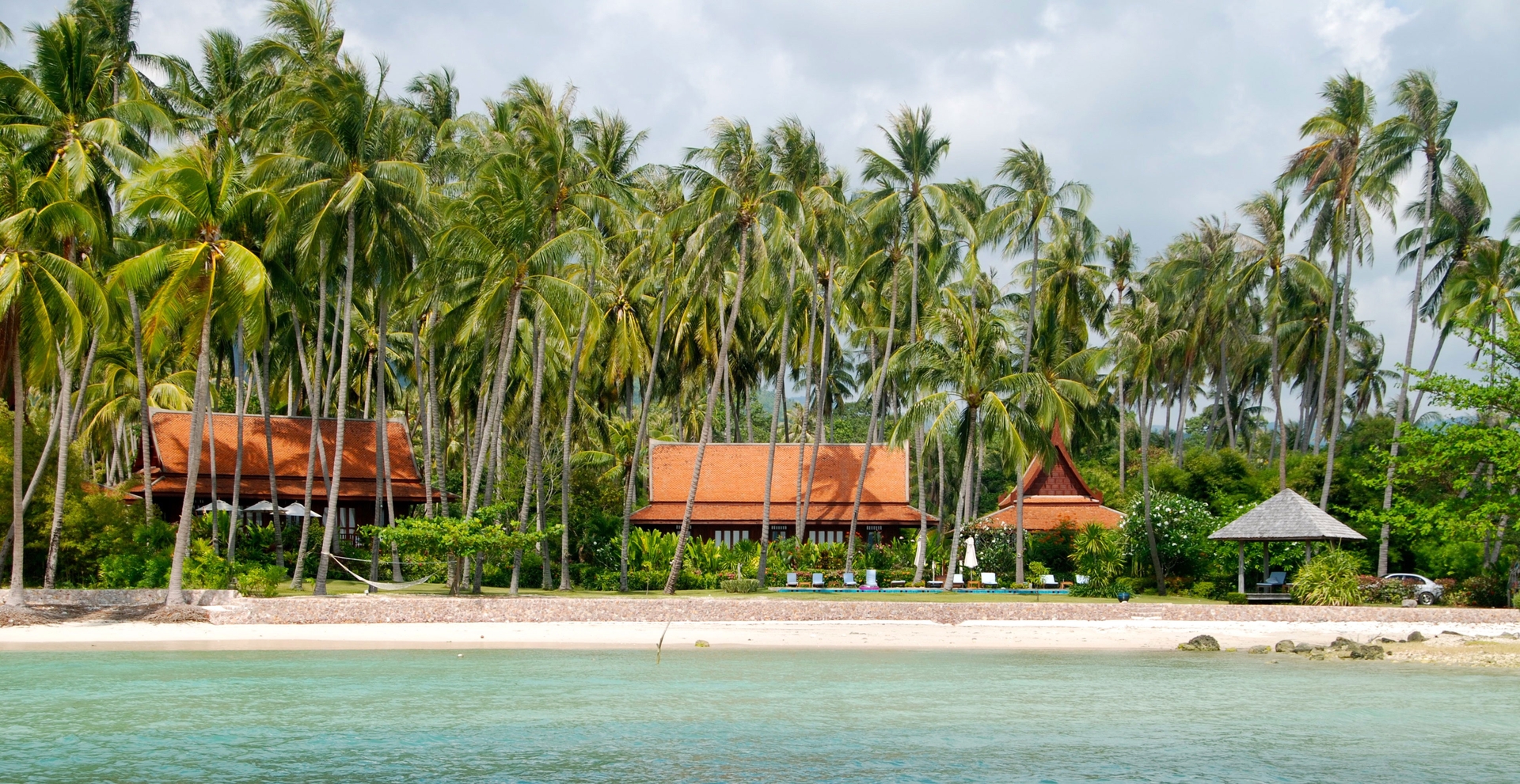 Ayutthaya-Style Teakwood Pavilions Seen from the Turquoise Sea