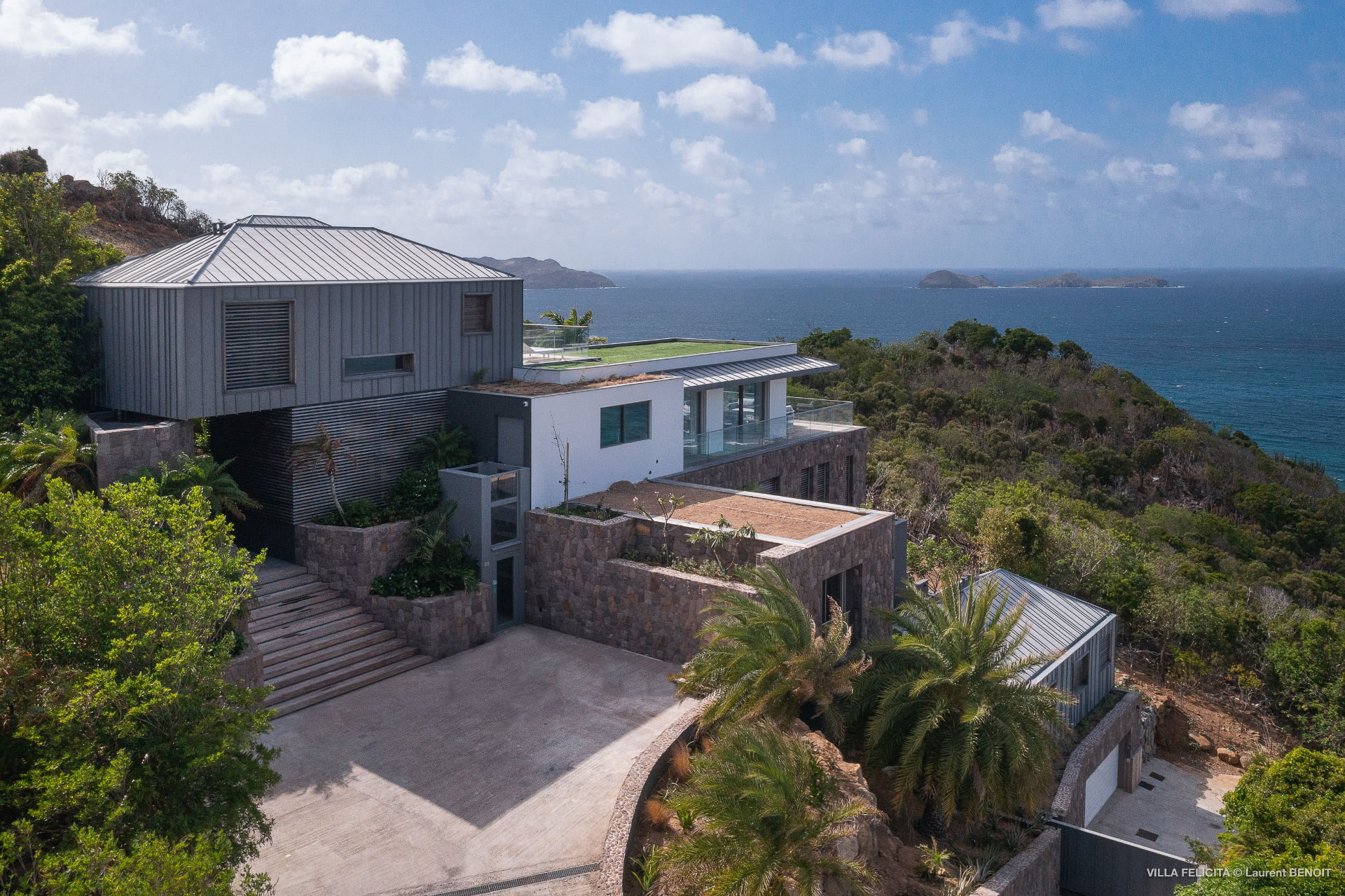 Aerial view of the contemporary hillside villa above the Caribbean Sea