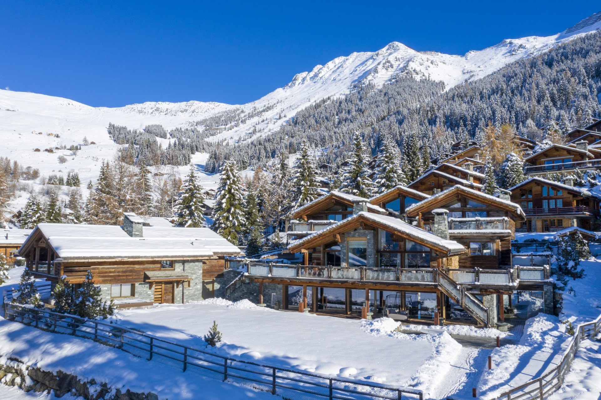 Chalet Complex in Fresh Snow Beneath Alpine Peaks