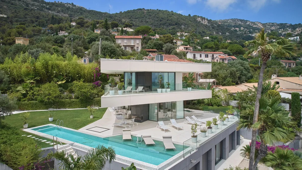 Aerial View of Modern Villa with Pool and Hillside Setting