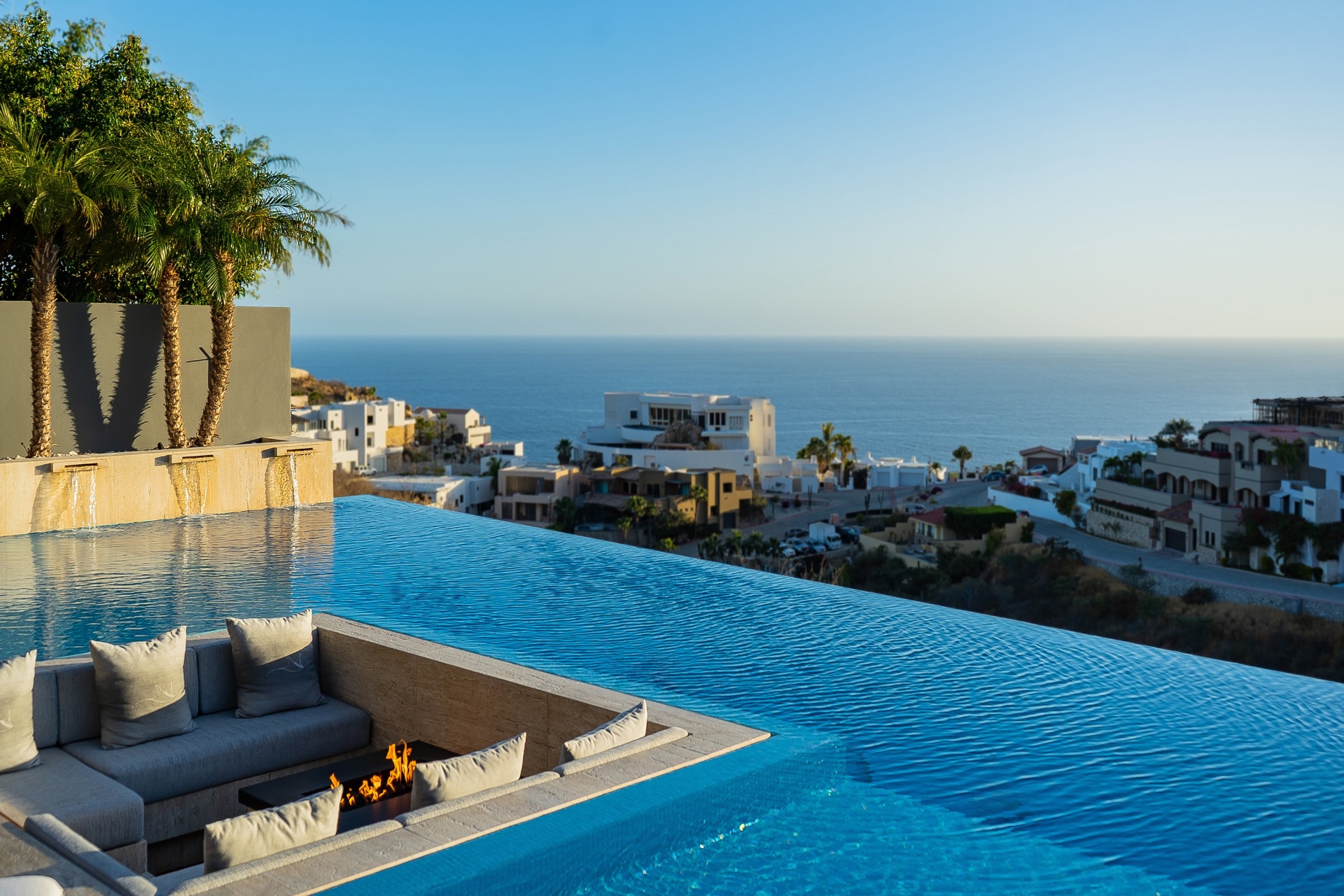 Infinity Pool with Sunken Firepit and Ocean Panorama