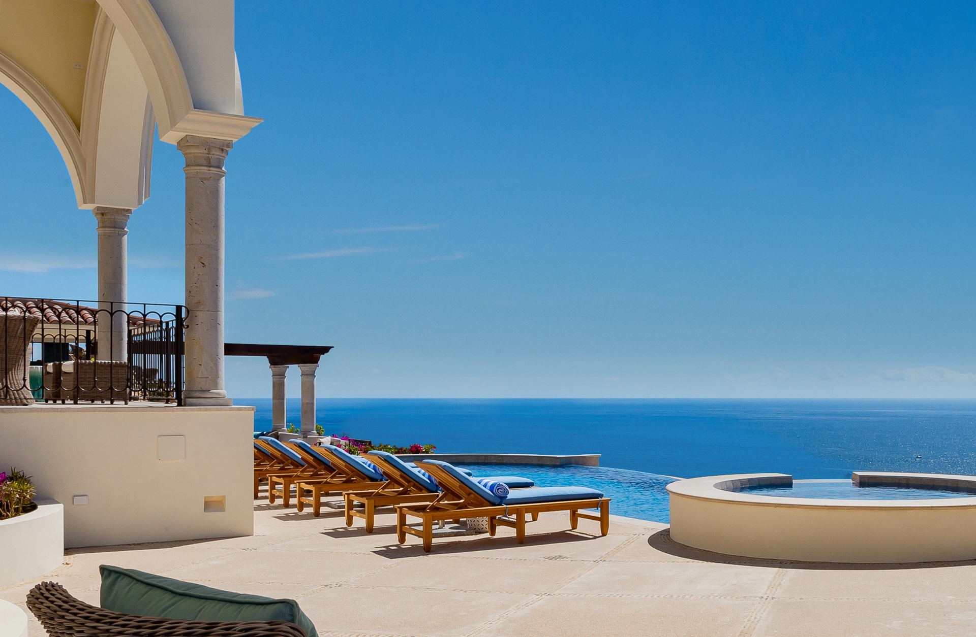 Pool Deck with Loungers and Ocean Panorama