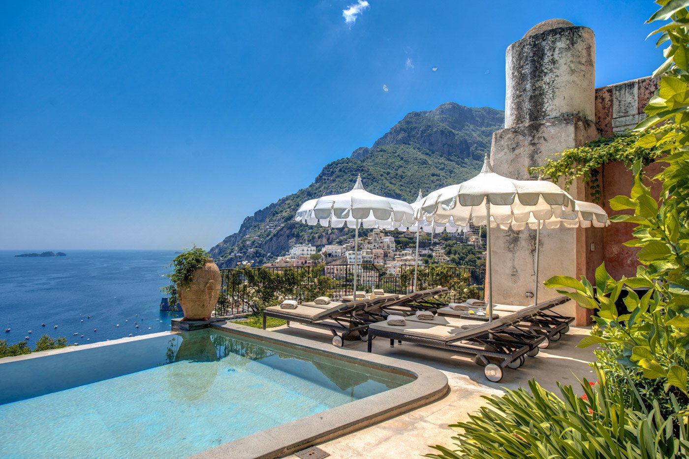 Villa Positano Infinity Pool with Loungers and Umbrellas