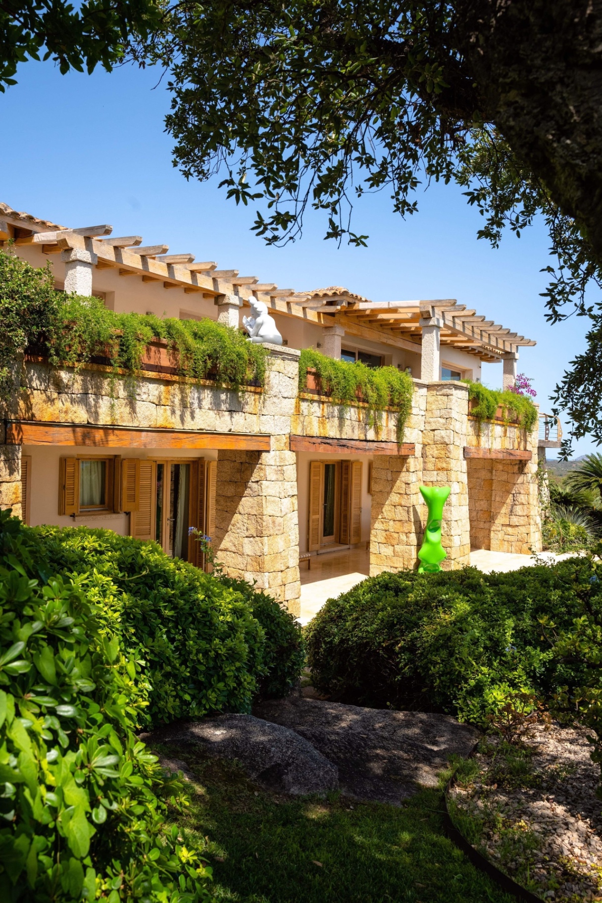 Estate Exterior with Mediterranean Architecture and Lush Gardens