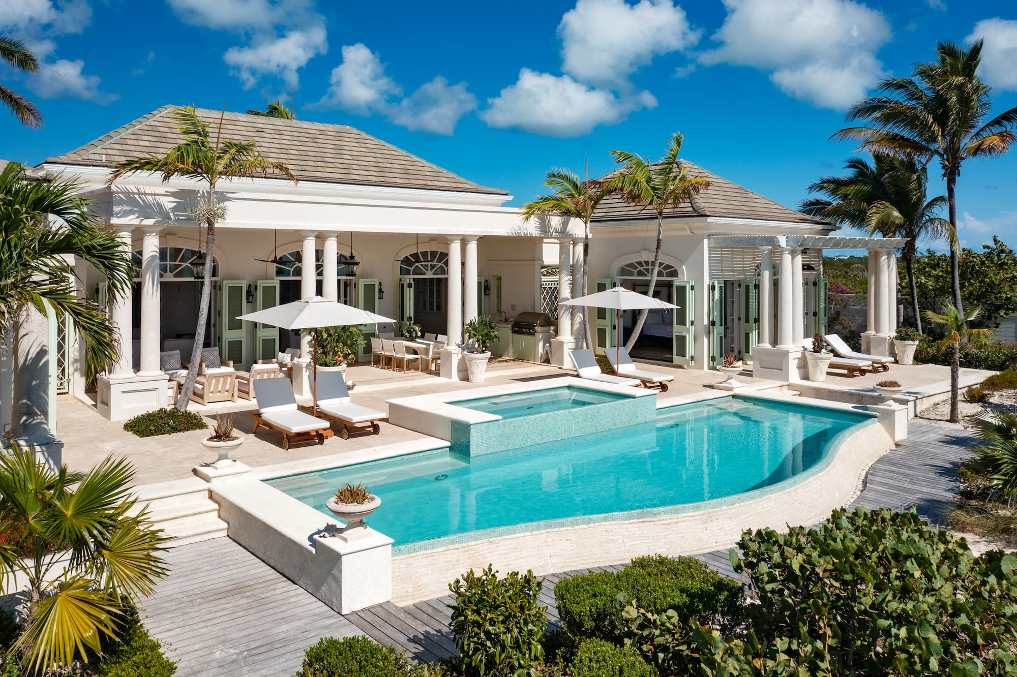 Colonial Pool Villa with Green Shutters and Palm Trees