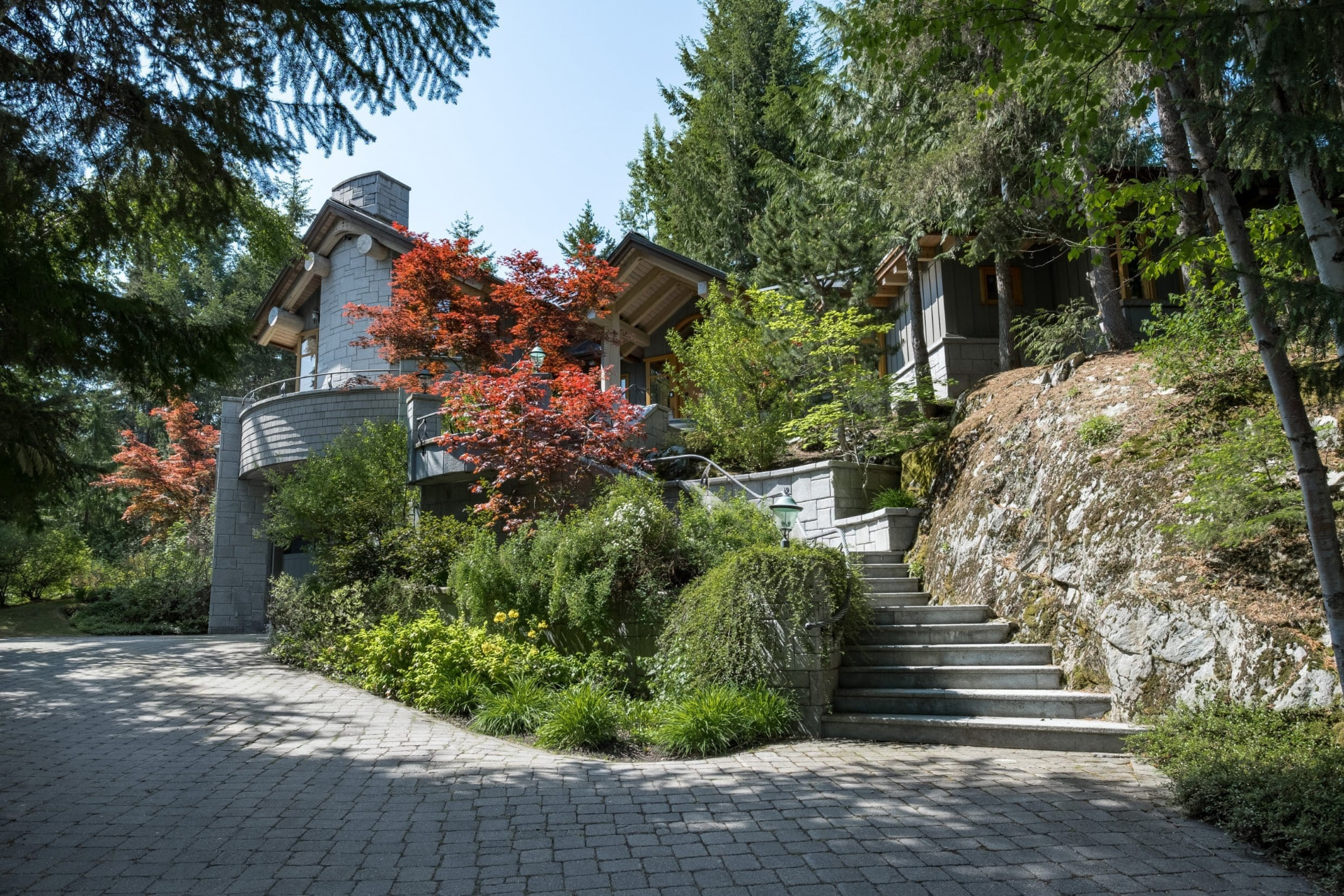 Stone Chalet with Japanese Maples and Paved Driveway in Whistler Forest