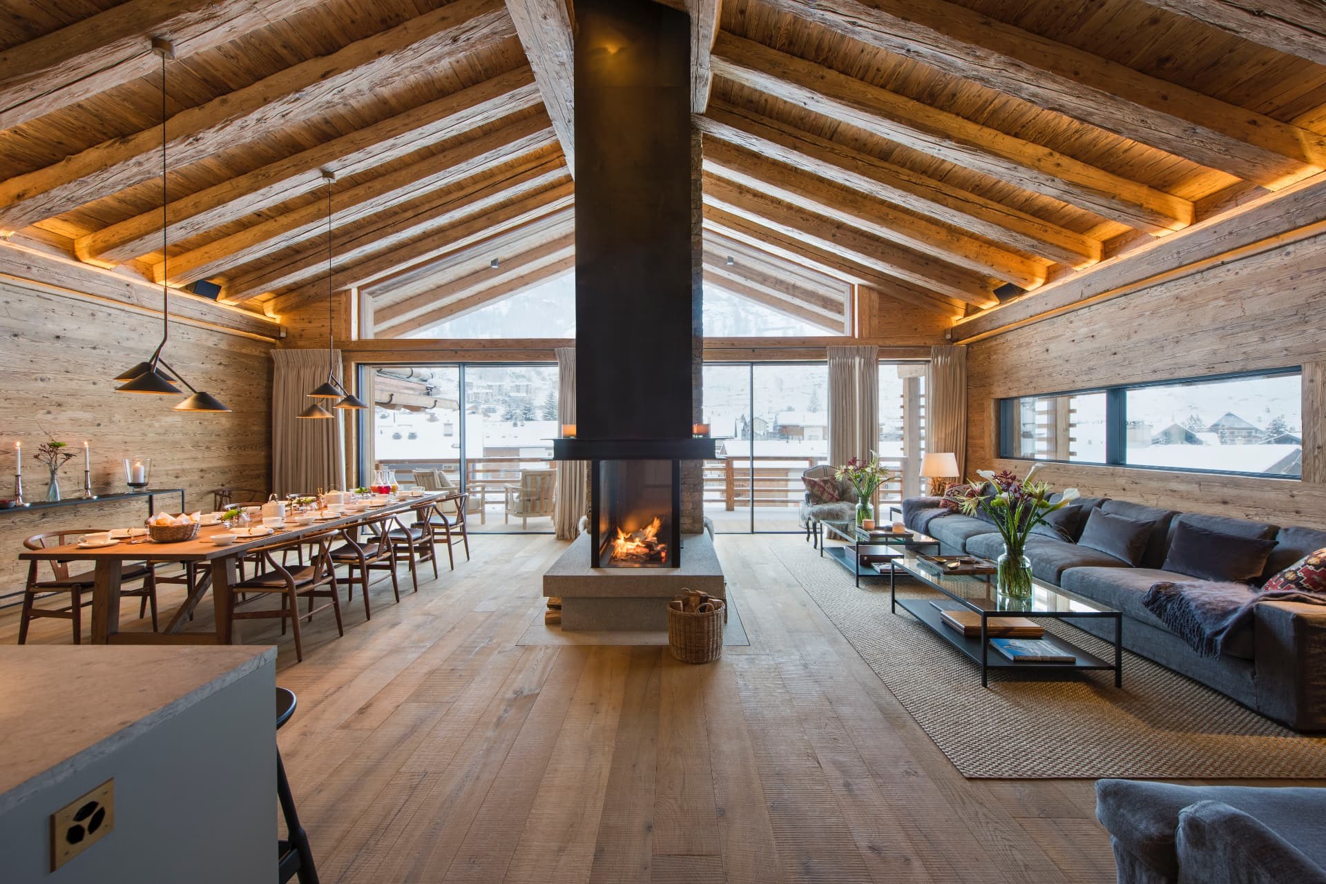 Vaulted Great Room with Central Fireplace and Village Views